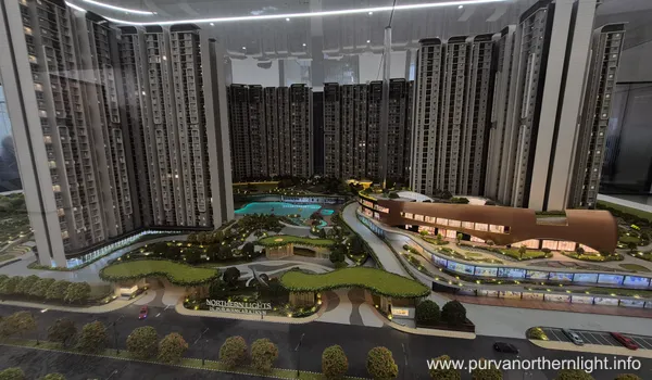 A focused shot of the 100,000 sq. ft. dual clubhouses model at Purva Northern Lights, featuring multiple levels and surrounding leisure zones like the swimming pool and sports courts.